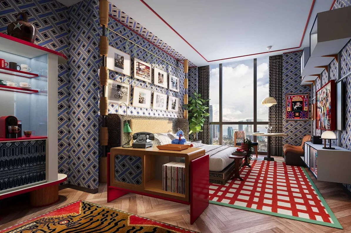 Reference image: a hotel room with trellis wallpaper, a gallery wall, a red writing desk and a red-and-white checked rug.